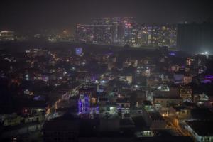 A layer of smog envelops the skyline as residential buildings are decorated with colorful lights during Diwali, November 14, 2020(AP) A layer of smog envelops the skyline as residential buildings are decorated with colorful lights during Diwali, November 14, 2020(AP)