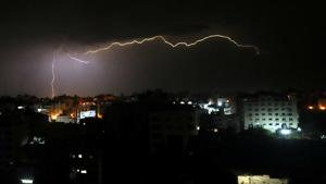Lightnings strike over Gaza City .(Reuters) Lightnings strike over Gaza City .(Reuters)