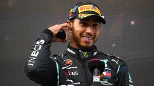 Mercedes' Lewis Hamilton gives an interview after winning the race and the world championship.(Pool via REUTERS) Mercedes' Lewis Hamilton gives an interview after winning the race and the world championship.(Pool via REUTERS)