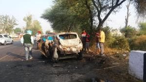 The charred remains of the car after it collided with a Canter and caught fire on Sunam road on the outskirts of Sangrur town on Monday night.(HT Photo) The charred remains of the car after it collided with a Canter and caught fire on Sunam road on the outskirts of Sangrur town on Monday night.(HT Photo)
