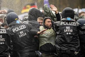 Berlin police spokesman Thilo Cabiltz said that more than 100 people were arrested and many more temporarily detained.(AP) Berlin police spokesman Thilo Cabiltz said that more than 100 people were arrested and many more temporarily detained.(AP)