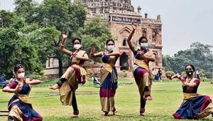 This is a group of young women, wearing the same kind of saris, same kind of bangles, but not the same kind of face masks. This is a group of young women, wearing the same kind of saris, same kind of bangles, but not the same kind of face masks.