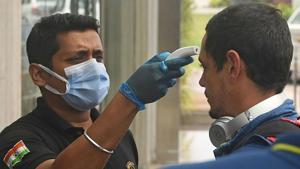 Quinton de Kock gets a temperature check done before leaving for South Africa from India earlier this year.(Getty Images) Quinton de Kock gets a temperature check done before leaving for South Africa from India earlier this year.(Getty Images)