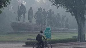 A cyclist rides through smog post 'Diwali' celebrations, in New Delhi.(PTI) A cyclist rides through smog post 'Diwali' celebrations, in New Delhi.(PTI)