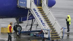 Workers walk near a Boeing 737 Max 8 built for Southwest Airlines at Renton Municipal Airport on Wednesday.(AP Photo) Workers walk near a Boeing 737 Max 8 built for Southwest Airlines at Renton Municipal Airport on Wednesday.(AP Photo)
