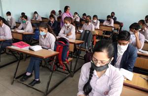 Students attending a class at a government school in Rohtak district last week. The school education department has directed all district education officers to ensure sanitisation of schools.(Manoj Dhaka/HT) Students attending a class at a government school in Rohtak district last week. The school education department has directed all district education officers to ensure sanitisation of schools.(Manoj Dhaka/HT)