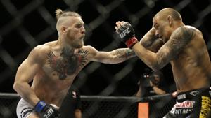 In this Sept. 27, 2014, file photo, Conor McGregor, left, and Dustin Poirier, exchange hits during their mixed martial arts bout in Las Vegas.(AP) In this Sept. 27, 2014, file photo, Conor McGregor, left, and Dustin Poirier, exchange hits during their mixed martial arts bout in Las Vegas.(AP)