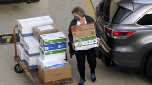 Election officials from around Dane County bring ballots in, Thursday, Nov., 19, 2020 to the Monona Terrace in Madison, Wis. for the recount that begins Friday.(AP File Photo) Election officials from around Dane County bring ballots in, Thursday, Nov., 19, 2020 to the Monona Terrace in Madison, Wis. for the recount that begins Friday.(AP File Photo)
