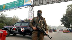 A security personnel stands guard at the encounter site.(ANI Phoyo) A security personnel stands guard at the encounter site.(ANI Phoyo)