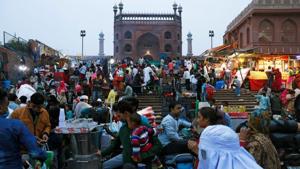 People shop at a market, amid the coronavirus disease outbreak, in front of the Jama Masjid (Grand Mosque) in the old quarters of Delhi.(REUTERS) People shop at a market, amid the coronavirus disease outbreak, in front of the Jama Masjid (Grand Mosque) in the old quarters of Delhi.(REUTERS)