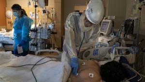Dr. Rafik Abdou checks on a Covid-19 patient at Providence Holy Cross Medical Center in the Mission Hills section of Los Angeles, Thursday.(AP File Photo) Dr. Rafik Abdou checks on a Covid-19 patient at Providence Holy Cross Medical Center in the Mission Hills section of Los Angeles, Thursday.(AP File Photo)