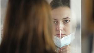 University of Utah student Abigail Shull takes a rapid COVID-19 test Wednesday, Nov. 18, 2020, in Salt Lake City.(AP) University of Utah student Abigail Shull takes a rapid COVID-19 test Wednesday, Nov. 18, 2020, in Salt Lake City.(AP)