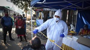A health worker collects a swab sample to test for coronavirus infection, at Najafgarh, in New Delhi, India, on Friday, November 20, 2020. (Photo by Sanchit Khanna/ Hindustan Times) A health worker collects a swab sample to test for coronavirus infection, at Najafgarh, in New Delhi, India, on Friday, November 20, 2020. (Photo by Sanchit Khanna/ Hindustan Times)
