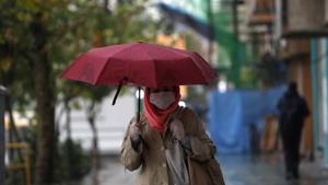 An Iranian woman wearing a protective face mask, walks on the street, as government imposed a full lockdown, amid the spread of the coronavirus disease in Tehran, Iran.(VIA REUTERS) An Iranian woman wearing a protective face mask, walks on the street, as government imposed a full lockdown, amid the spread of the coronavirus disease in Tehran, Iran.(VIA REUTERS)