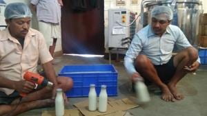 The staff of a boarding school in Ranchi is bottling the milk produced by cows at the campus to be sold to general public in absence of resident students.(HT Photo) The staff of a boarding school in Ranchi is bottling the milk produced by cows at the campus to be sold to general public in absence of resident students.(HT Photo)
