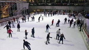 The iconic, sunken rink in midtown Manhattan is welcoming skaters Saturday, Nov. 21, 2020, as part of a tradition dating to the 1930s, according to the Rockefeller Center website.The rink is operating at a reduced capacity, with skate time limited to 50 minutes. Masks are required as a further pandemic safety measure.(AP) The iconic, sunken rink in midtown Manhattan is welcoming skaters Saturday, Nov. 21, 2020, as part of a tradition dating to the 1930s, according to the Rockefeller Center website.The rink is operating at a reduced capacity, with skate time limited to 50 minutes. Masks are required as a further pandemic safety measure.(AP)