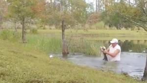 The video shows the 74-year-old, identified as Richard Wilbanks, in the pond wrestling with the alligator to save his three-month-old puppy Gunner.(Screengrab) The video shows the 74-year-old, identified as Richard Wilbanks, in the pond wrestling with the alligator to save his three-month-old puppy Gunner.(Screengrab)