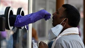 A health worker takes a sample for a Covid-19 test at Lucknow’s Ram Manohar Lohia Hospital.(HT PHOTO) A health worker takes a sample for a Covid-19 test at Lucknow’s Ram Manohar Lohia Hospital.(HT PHOTO)
