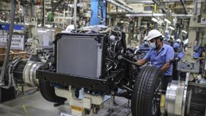 Workers labour at a chassis assembly line on the Innova Crysta compact multi-purpose vehicle (MPV) production line at the Toyota Kirloskar Motor Ltd. plant in Bidadi, Karnataka.(Bloomberg File Photo) Workers labour at a chassis assembly line on the Innova Crysta compact multi-purpose vehicle (MPV) production line at the Toyota Kirloskar Motor Ltd. plant in Bidadi, Karnataka.(Bloomberg File Photo)