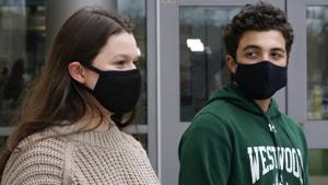 While wearing protective masks due to the COVID-19 outbreak, Lucy Vitali, who portrays Juliet, left, stands with Alex Mansour, who portrays Romeo, outside the auditorium after working on their virtual performance of Shakespeare's While wearing protective masks due to the COVID-19 outbreak, Lucy Vitali, who portrays Juliet, left, stands with Alex Mansour, who portrays Romeo, outside the auditorium after working on their virtual performance of Shakespeare's