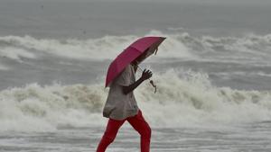A man walks along a shore before the landfall of Cyclone Nivar, at Marina Beach in Chennai on Tuesday.(PTI Photo) A man walks along a shore before the landfall of Cyclone Nivar, at Marina Beach in Chennai on Tuesday.(PTI Photo)