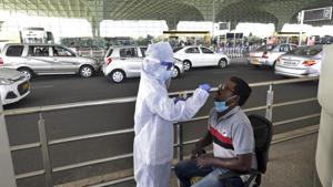 Mumbai, India - Nov. 25, 2020: Healthcare workers during COVID-19 screening and swab test of passengers at Chhatrapati Shivaji Maharaj International Airport, Andheri in Mumbai, India, on Wednesday, November 25, 2020. (Photo by Satyabrata Tripathy/Hindustan Times) Mumbai, India - Nov. 25, 2020: Healthcare workers during COVID-19 screening and swab test of passengers at Chhatrapati Shivaji Maharaj International Airport, Andheri in Mumbai, India, on Wednesday, November 25, 2020. (Photo by Satyabrata Tripathy/Hindustan Times)