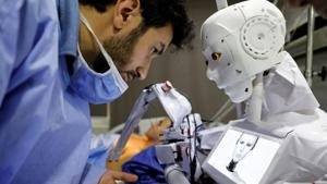 Mahmoud El Komy, a 26-year-old Egyptian mechatronics engineer, stands beside Cira 3, a remote-controlled robot that runs tests on suspected coronavirus disease (Covid-19) patients, to limit the human exposure to the virus, amid a second wave of infections in Tanta, Egypt.(REUTERS) Mahmoud El Komy, a 26-year-old Egyptian mechatronics engineer, stands beside Cira 3, a remote-controlled robot that runs tests on suspected coronavirus disease (Covid-19) patients, to limit the human exposure to the virus, amid a second wave of infections in Tanta, Egypt.(REUTERS)