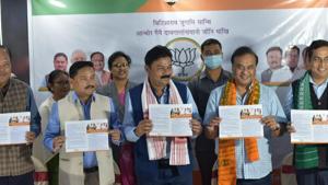 Assam BJP president Ranjeet Kumar Dass (centre) and finance minister Himanta Biswa Sarma (second from right) at the BJP manifesto release programme in Kokrajhar on Friday.(Courtesy-Himanta Biswa Sarma/Twitter)