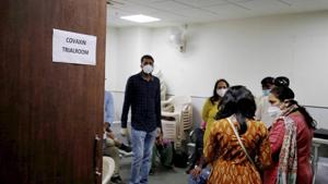 People wait during the administration of Covaxin, a government-backed experimental Covid-19 vaccine, during its human trials, at the Gujarat Medical Education & Research Society in Ahmedabad, on Thursday.(PTI Photo) People wait during the administration of Covaxin, a government-backed experimental Covid-19 vaccine, during its human trials, at the Gujarat Medical Education & Research Society in Ahmedabad, on Thursday.(PTI Photo)
