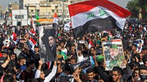 Most of al-Sadr’s followers stood unmasked in the square, chanting: “Yes, yes for our leader,” in support of the firebrand cleric as Iraq remains a high-risk country for coronavirus infection.(AFP Photo) Most of al-Sadr’s followers stood unmasked in the square, chanting: “Yes, yes for our leader,” in support of the firebrand cleric as Iraq remains a high-risk country for coronavirus infection.(AFP Photo)