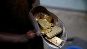 An employee holds gold bars before the refining process at AGR (African Gold Refinery) in Entebbe, Uganda(Reuters File Photo) An employee holds gold bars before the refining process at AGR (African Gold Refinery) in Entebbe, Uganda(Reuters File Photo)