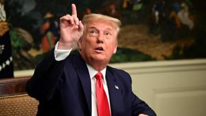 US President Donald Trump gestures as he participates in a Thanksgiving video teleconference with members of the military forces at the White House in Washington, on November 26.(Reuters) US President Donald Trump gestures as he participates in a Thanksgiving video teleconference with members of the military forces at the White House in Washington, on November 26.(Reuters)