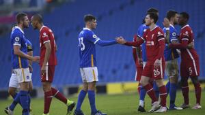 Brighton's Pascal Gross, left, greets Liverpool's Andrew Robertson at the end of the English Premier League soccer match between Brighton and Hove Albion and Liverpool at the Amex stadium in Brighton.(AP) Brighton's Pascal Gross, left, greets Liverpool's Andrew Robertson at the end of the English Premier League soccer match between Brighton and Hove Albion and Liverpool at the Amex stadium in Brighton.(AP)