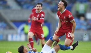 Liverpool’s Diogo Jota in action with Brighton & Hove Albion’s Ben White.(Reuters) Liverpool’s Diogo Jota in action with Brighton & Hove Albion’s Ben White.(Reuters)