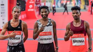 Indian men's category Gold medalist Avinash Sable flanked by Silver medalist Srinu Bugatha and Bronze Medalist Durga Bahadur Budha pose for photographs at the Airtel Delhi Half Marathon.(PTI) Indian men's category Gold medalist Avinash Sable flanked by Silver medalist Srinu Bugatha and Bronze Medalist Durga Bahadur Budha pose for photographs at the Airtel Delhi Half Marathon.(PTI)