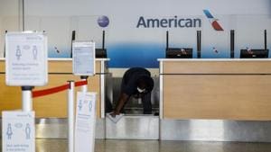 A worker cleans an American Airlines Group Inc. check-in counter at Tulsa International Airport (TUL) in Tulsa, Oklahoma, US.(Bloomberg) A worker cleans an American Airlines Group Inc. check-in counter at Tulsa International Airport (TUL) in Tulsa, Oklahoma, US.(Bloomberg)