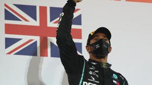 Mercedes' Lewis Hamilton celebrates on the podium after winning the race.(Pool via REUTERS) Mercedes' Lewis Hamilton celebrates on the podium after winning the race.(Pool via REUTERS)