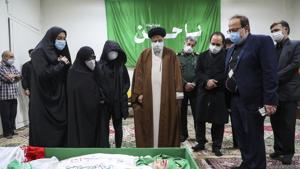 Iran's Judiciary Chief Ayatollah Ebrahim Raisi pays his respect to the body of slain scientist Mohsen Fakhrizadeh among his family, in Tehran, Iran.(AP) Iran's Judiciary Chief Ayatollah Ebrahim Raisi pays his respect to the body of slain scientist Mohsen Fakhrizadeh among his family, in Tehran, Iran.(AP)