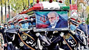 Members of Iranian forces carry the coffin of slain scientist Mohsen Fakhrizadeh during his funeral ceremony in Tehran. Members of Iranian forces carry the coffin of slain scientist Mohsen Fakhrizadeh during his funeral ceremony in Tehran.