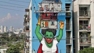 Artist Mundano works on a graffiti called Invisible Heroines, a tribute to women braving pandemic in Sao Paulo, Brazil. Artist Mundano works on a graffiti called Invisible Heroines, a tribute to women braving pandemic in Sao Paulo, Brazil.