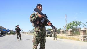 Afghan National Army officers stand guard at the site of a blast in Ghazni province, Afghanistan.(REUTERS) Afghan National Army officers stand guard at the site of a blast in Ghazni province, Afghanistan.(REUTERS)