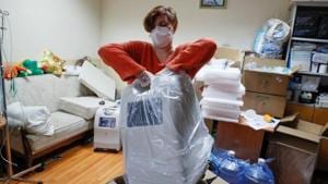 Lesya Lytvynova, co-founder of the Kyiv-based charity fund "Ours", unpacks a new oxygen generator in her office in Kyiv, Ukraine.(REUTERS) Lesya Lytvynova, co-founder of the Kyiv-based charity fund "Ours", unpacks a new oxygen generator in her office in Kyiv, Ukraine.(REUTERS)