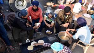 The farmers protesting against the newly enacted farm laws at Delhi-Haryana border on Monday offered prayers on the occasion of Guru Nanak Jayanti and distributed ‘prasad’ among each other and security personnel(ANI) The farmers protesting against the newly enacted farm laws at Delhi-Haryana border on Monday offered prayers on the occasion of Guru Nanak Jayanti and distributed ‘prasad’ among each other and security personnel(ANI)