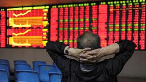 An investor places his hands on the back of his head in front of an electronic board showing stock information at a brokerage house in Hefei, Anhui province, China.(Reuters File Photo) An investor places his hands on the back of his head in front of an electronic board showing stock information at a brokerage house in Hefei, Anhui province, China.(Reuters File Photo)
