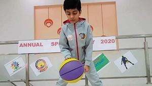 A student taking part in the ‘dribble the ball’ challenge during the annual sports day event. A student taking part in the ‘dribble the ball’ challenge during the annual sports day event.