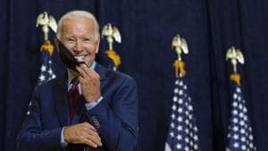 Joe Biden smiles as he puts on his face mask after speaking to media in Wilmington, Delaware on September 4.(AP file)