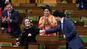 Canada's finance minister Chrystia Freeland receives a fist bump from Prime Minister Justin Trudeau in the House of Commons, in Ottawa, Ontario, Canada on November 30, 2020.(REUTERS) Canada's finance minister Chrystia Freeland receives a fist bump from Prime Minister Justin Trudeau in the House of Commons, in Ottawa, Ontario, Canada on November 30, 2020.(REUTERS)