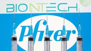 Syringes are seen in front of displayed BioNtech and Pfizer logos in this illustration.(REUTERS) Syringes are seen in front of displayed BioNtech and Pfizer logos in this illustration.(REUTERS)