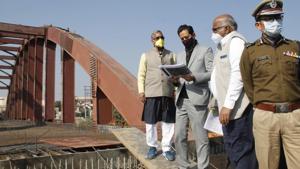 Chief minister Trivendra Singh Rawat with Mela officer Deepak Rawat, inspecting Kumbh works at a bridge site on Thursday in Haridwar.(HT Photo) Chief minister Trivendra Singh Rawat with Mela officer Deepak Rawat, inspecting Kumbh works at a bridge site on Thursday in Haridwar.(HT Photo)