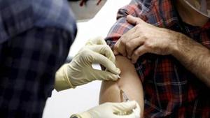 A medic administers Covaxin, an Indian government-backed experimental Covid-19 vaccine, to a health worker during its trials.(PTI Photo) A medic administers Covaxin, an Indian government-backed experimental Covid-19 vaccine, to a health worker during its trials.(PTI Photo)